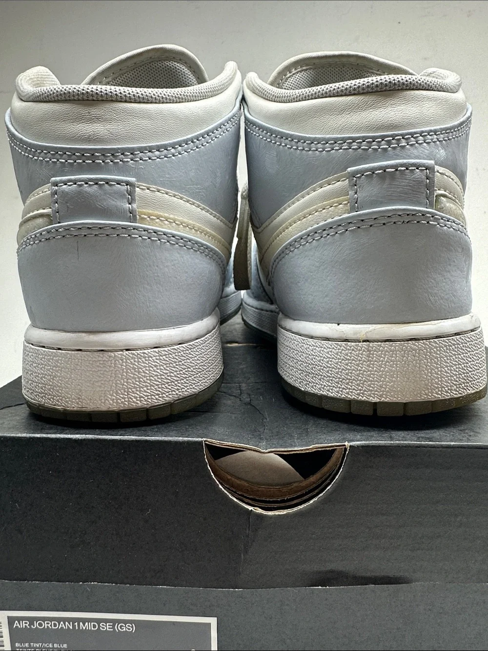 Air Jordan Kids Mid-Top Sneakers in White and Light Blue with Iridescent Swoosh